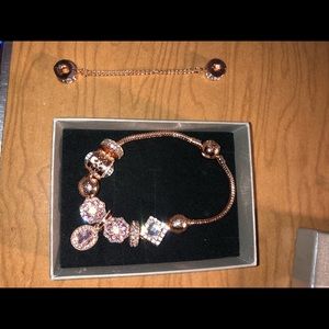 Rose gold Pandora bracelet w/ charms